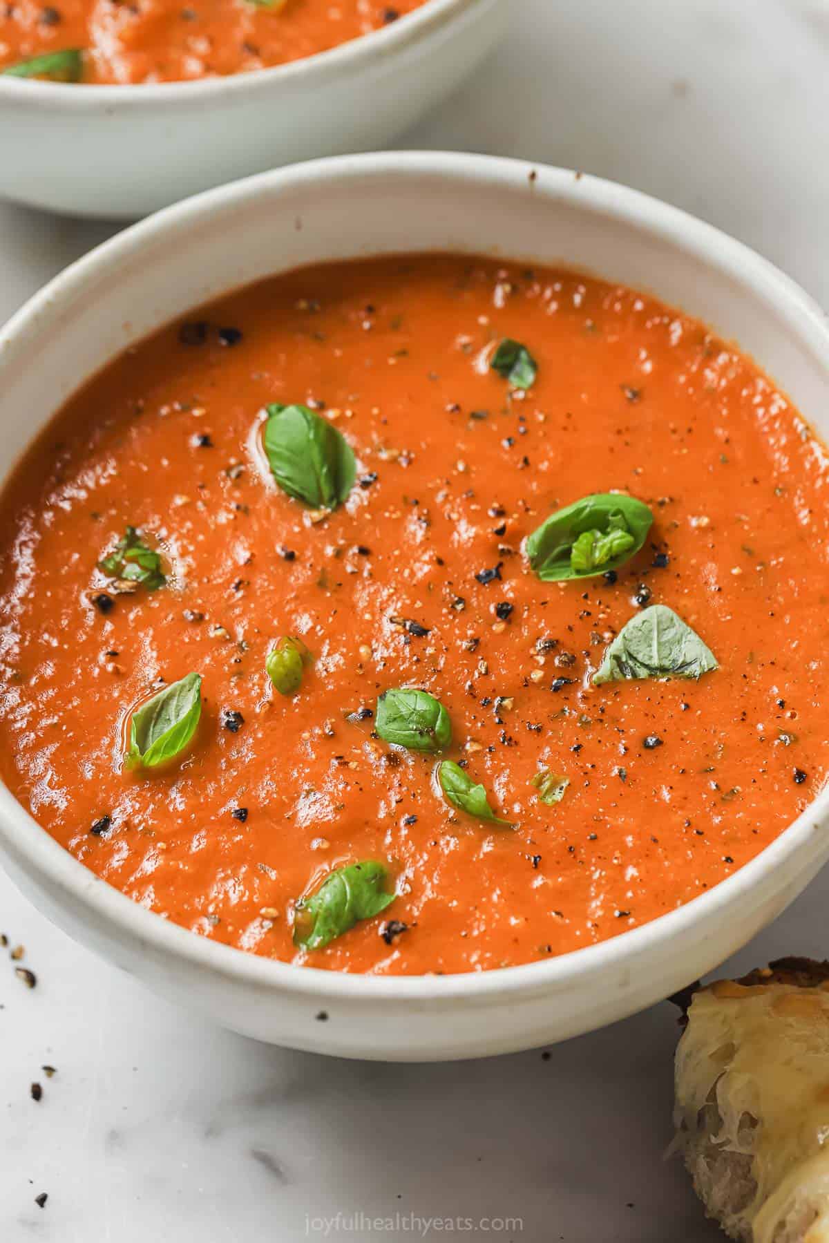 A bowl of tomato basil soup. 