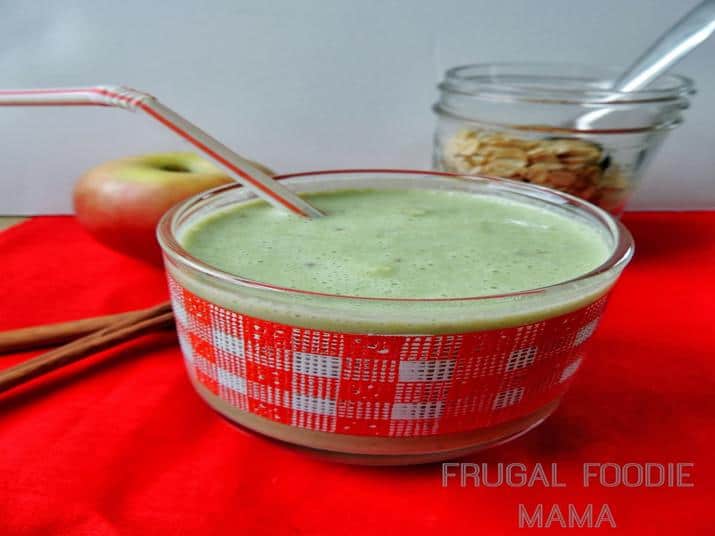 A Bowl with a Straw Filled with a Green Smoothie