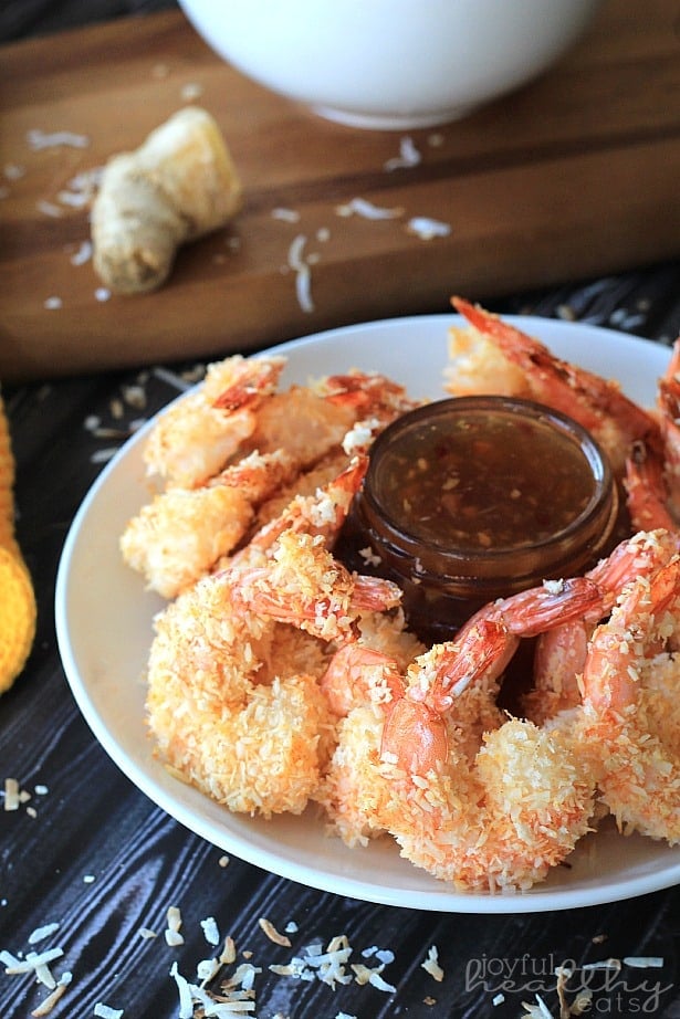 Coconut Shrimp in a Bowl with a Container of Dipping Sauce