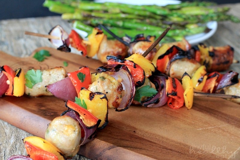 Grilled Chicken, Sausage, Pepper & Onion Kabobs on skewers