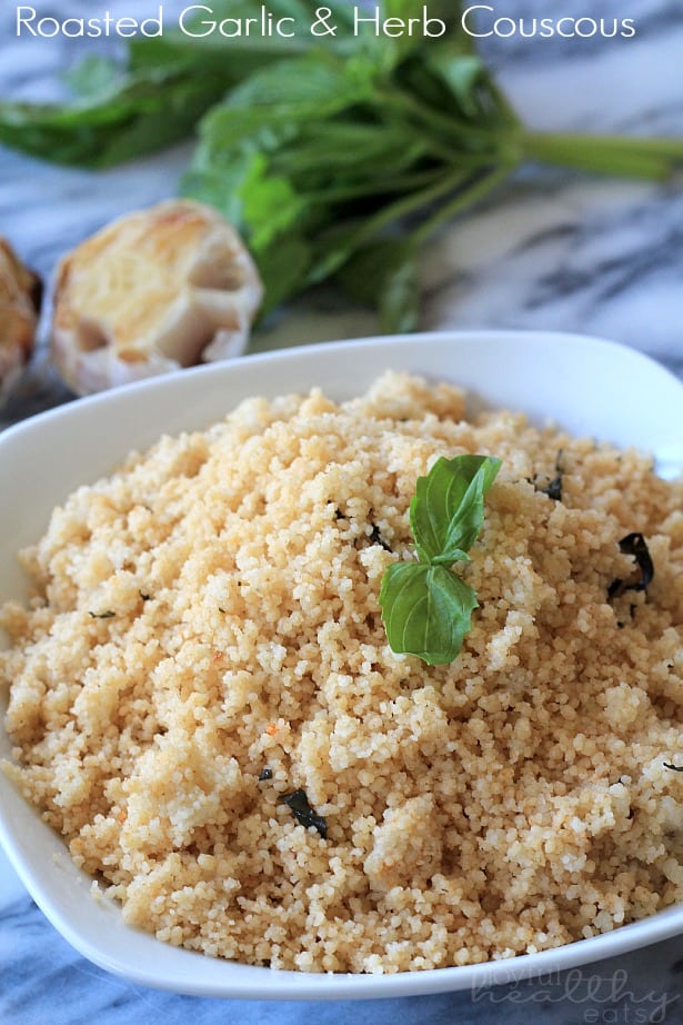 roasted herb and garlic couscous in white bowl on table