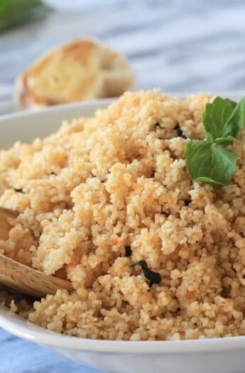 Roasted Garlic & Herb Couscous with a Wooden Spoon