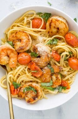 Overhead view of spicy shrimp pasta in bowl