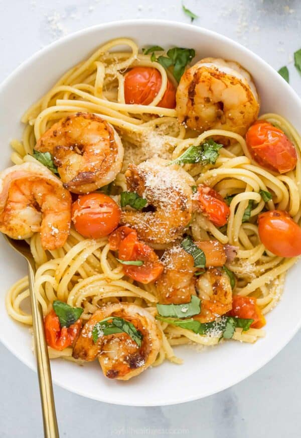 Overhead view of spicy shrimp pasta in bowl
