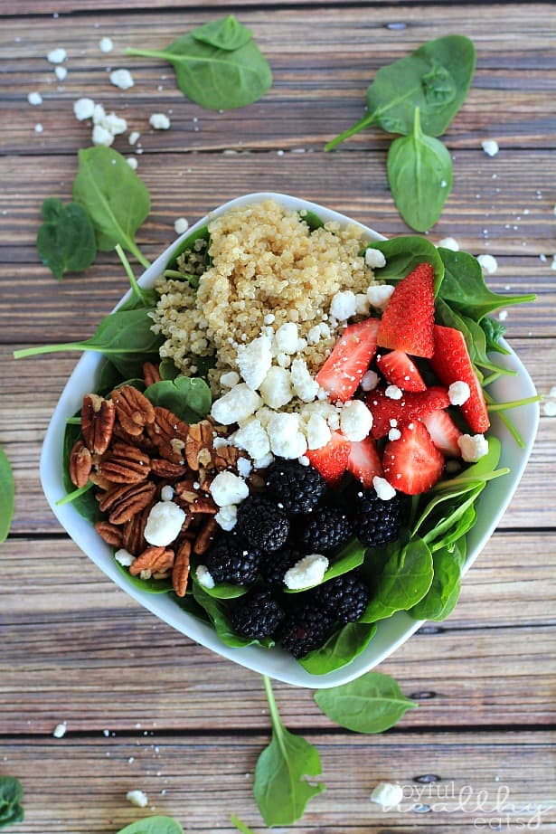 Top view of Detox Berry Quinoa Spinach Salad in a bowl