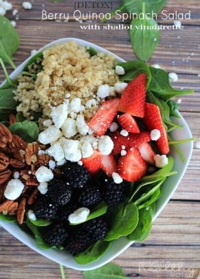 Spinach salad with fresh berries, quinoa, pecans and feta