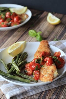 Panko Crusted Tilapia with Tomato Basil Sauce on a plate.