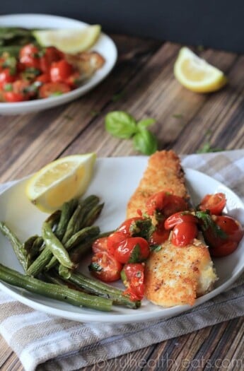 Panko Crusted Tilapia with Tomato Basil Sauce on a plate.