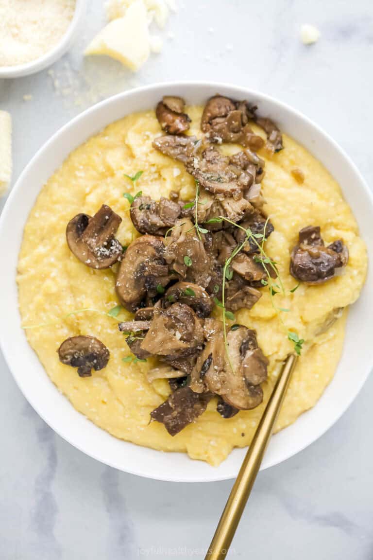 Bowl of mushroom polenta with spoon