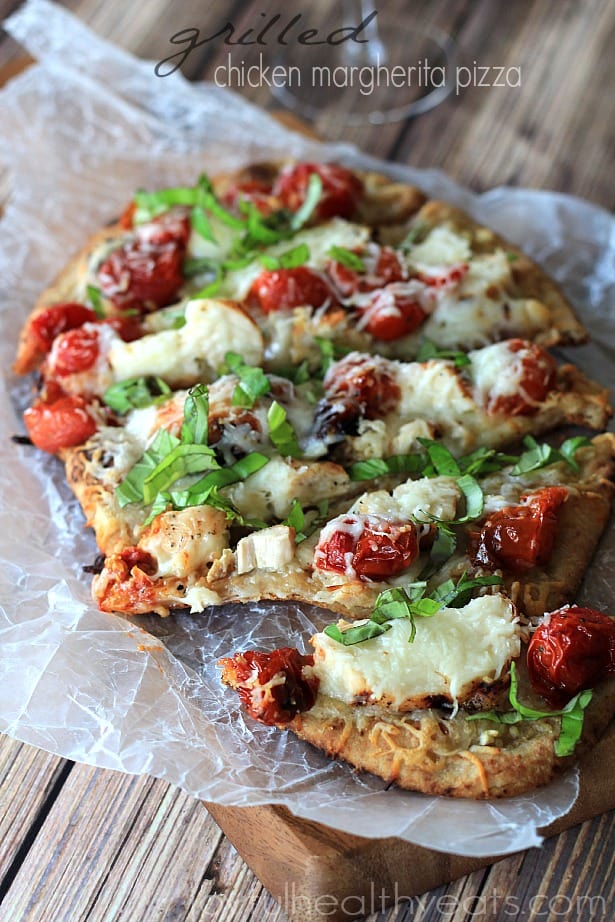 Sliced Grilled Chicken Margherita Pizza on parchment paper