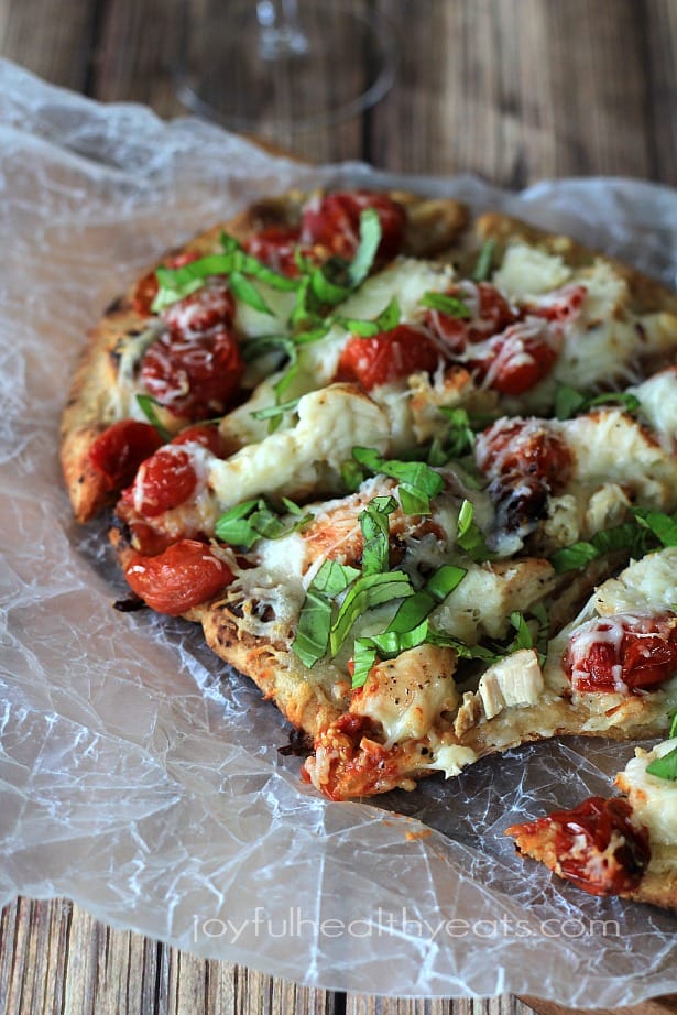 Sliced Grilled Chicken Margherita Pizza on parchment paper