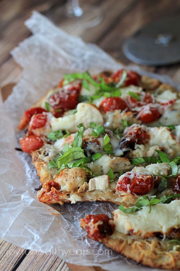 Sliced Grilled Chicken Margherita Pizza on parchment paper