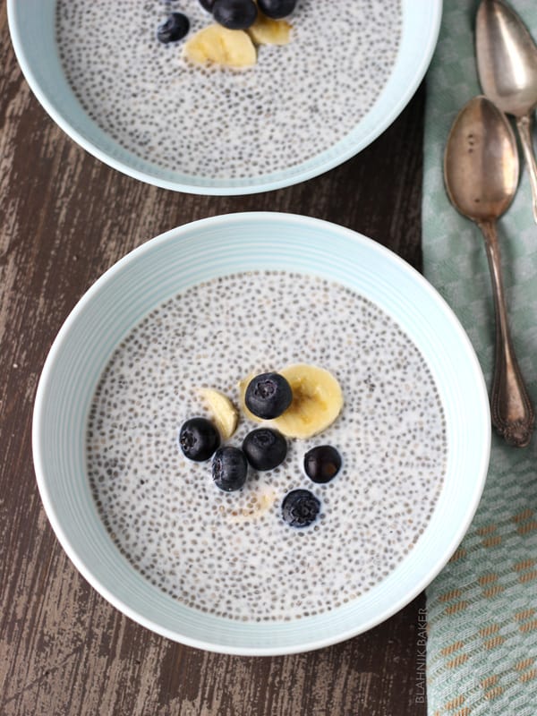 Top view of a bowl of Blueberry Almond Chia Pudding topped with fresh blueberries and banana slices