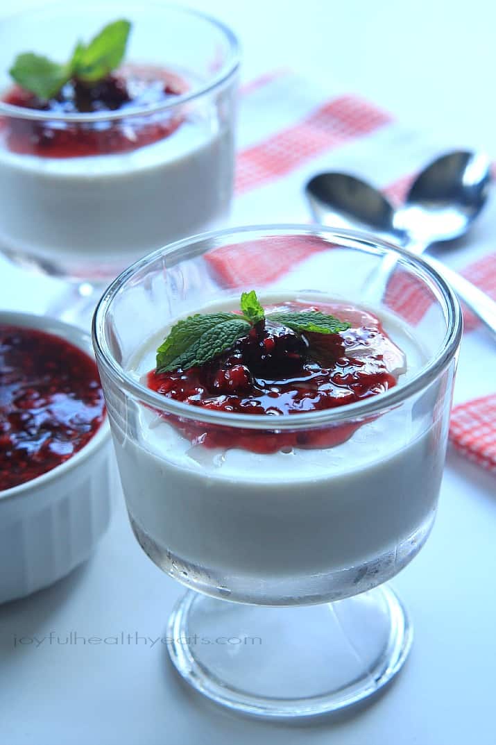 Coconut Panna Cotta topped with Raspberry Blackberry Compote in dessert glasses