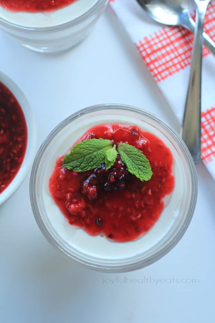 Top view of Coconut Panna Cotta topped with Raspberry Blackberry Compote in a dessert glass
