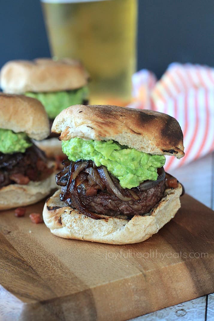 Close-up of a  Gourmet "Cowboy" Slider burger on a wooden board