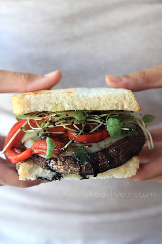 Grilled Portobello Burgers with Balsamic Reduction, red pepper, and sprouts on toasted bread