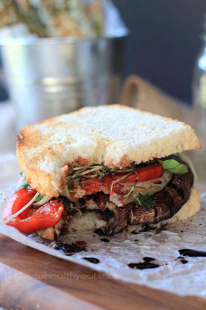 Grilled Portobello Burgers with Balsamic Reduction, red pepper, and sprouts on toasted bread