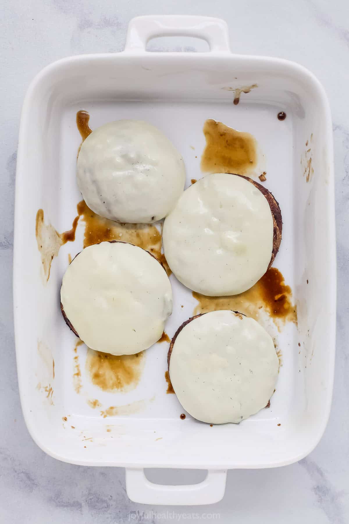 Melti provolone, roasted red pepper and creamy trafle IOli, it can only be the best portobelo mushroom sandwich! Grilled Portobelo Mushrooms are on top with overhead View Provolone