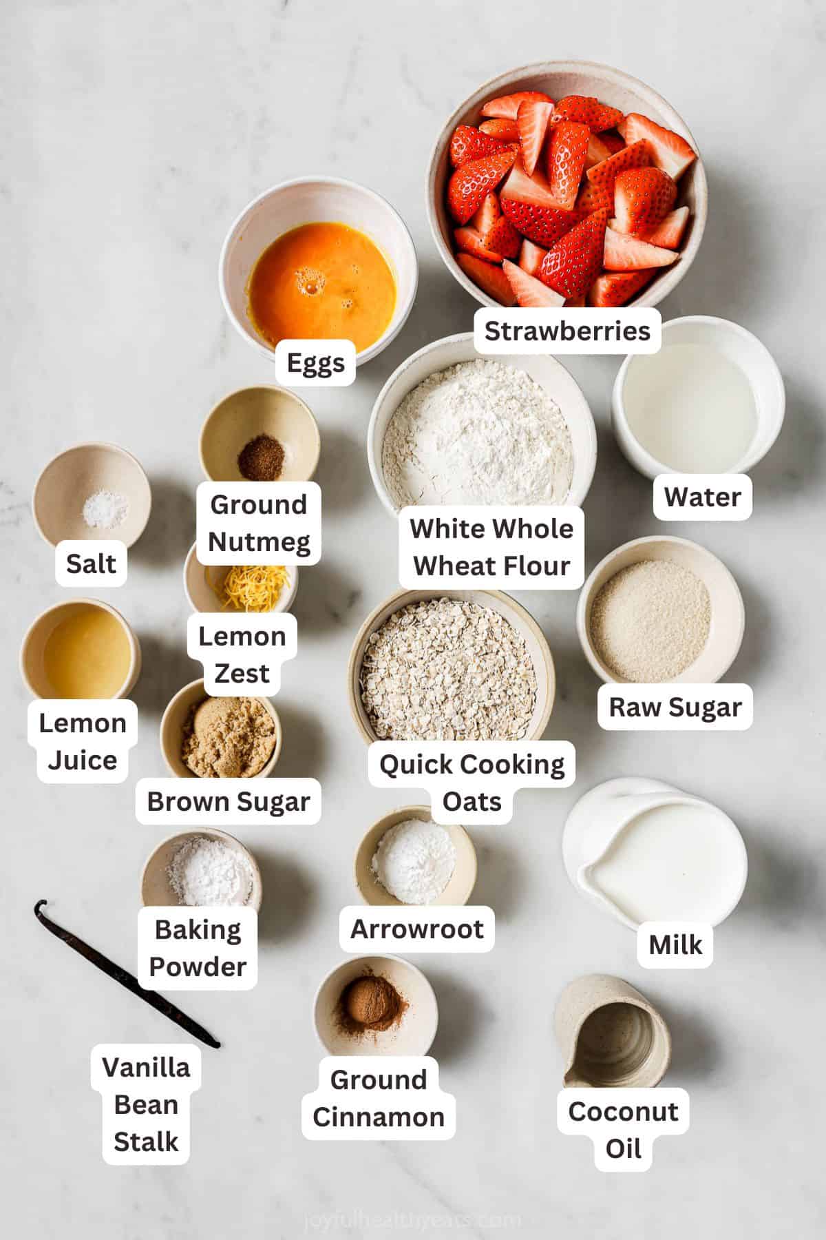 Overhead view of ingredients for oatmeal waffles and strawberry compote