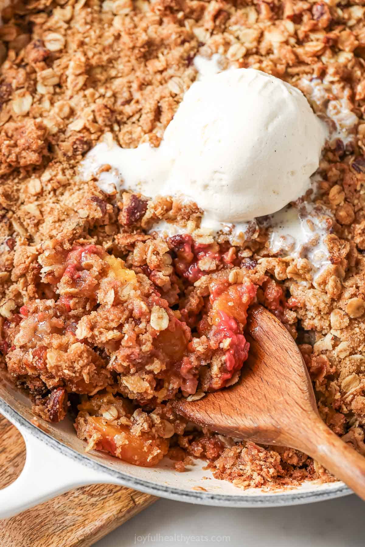 Crunch Oatmeal Pekan Charm. A simple summer sweet! Raspberry peach crisp skilllet with a scoop of ice cream above