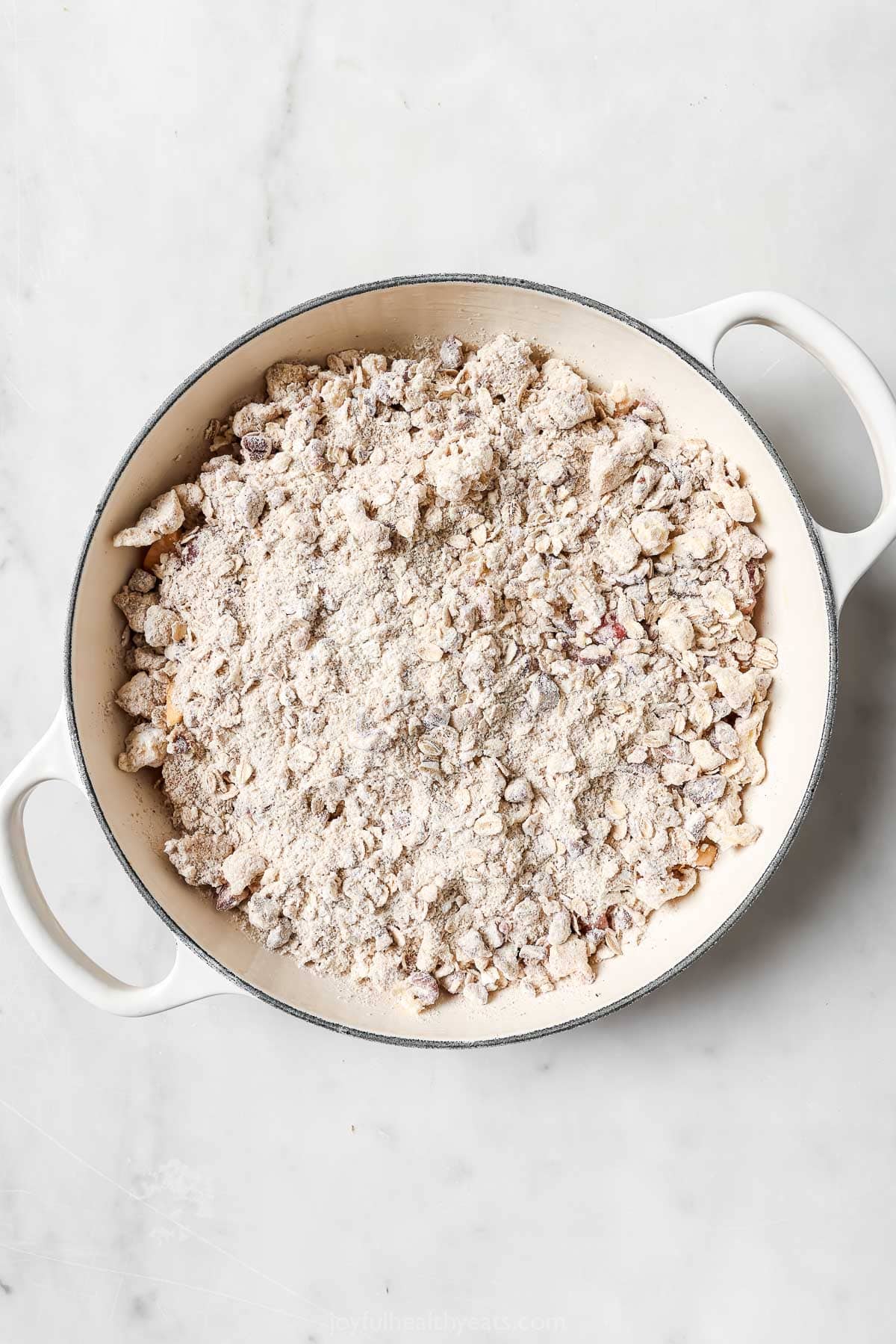 Crunch Oatmeal Pekan Charm. A simple summer sweet! Raspberry Peach Crisp's Skillet before baking
