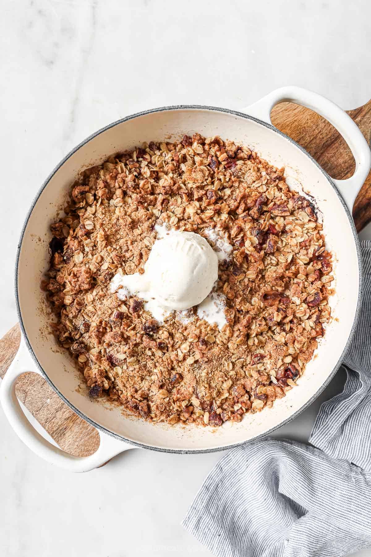 Crunch Oatmeal Pekan Charm. A simple summer sweet! Raspberry peach crisp skilllet with Vanilla ice cream scoop