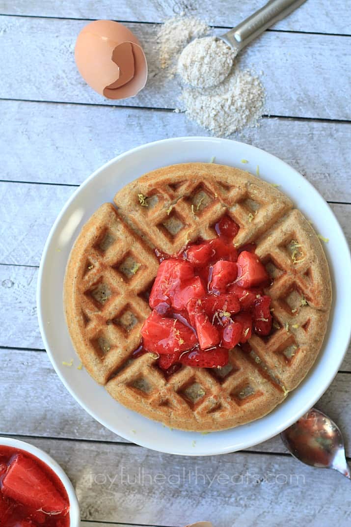Image of a Whole Wheat Oatmeal Waffle with Strawberry Compote on a Plate