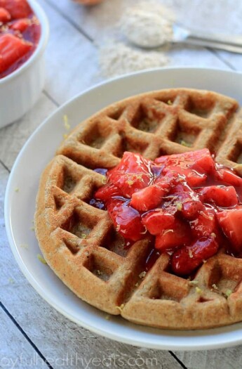A Whole Wheat Oatmeal Waffle Topped with Homemade Strawberry Compote