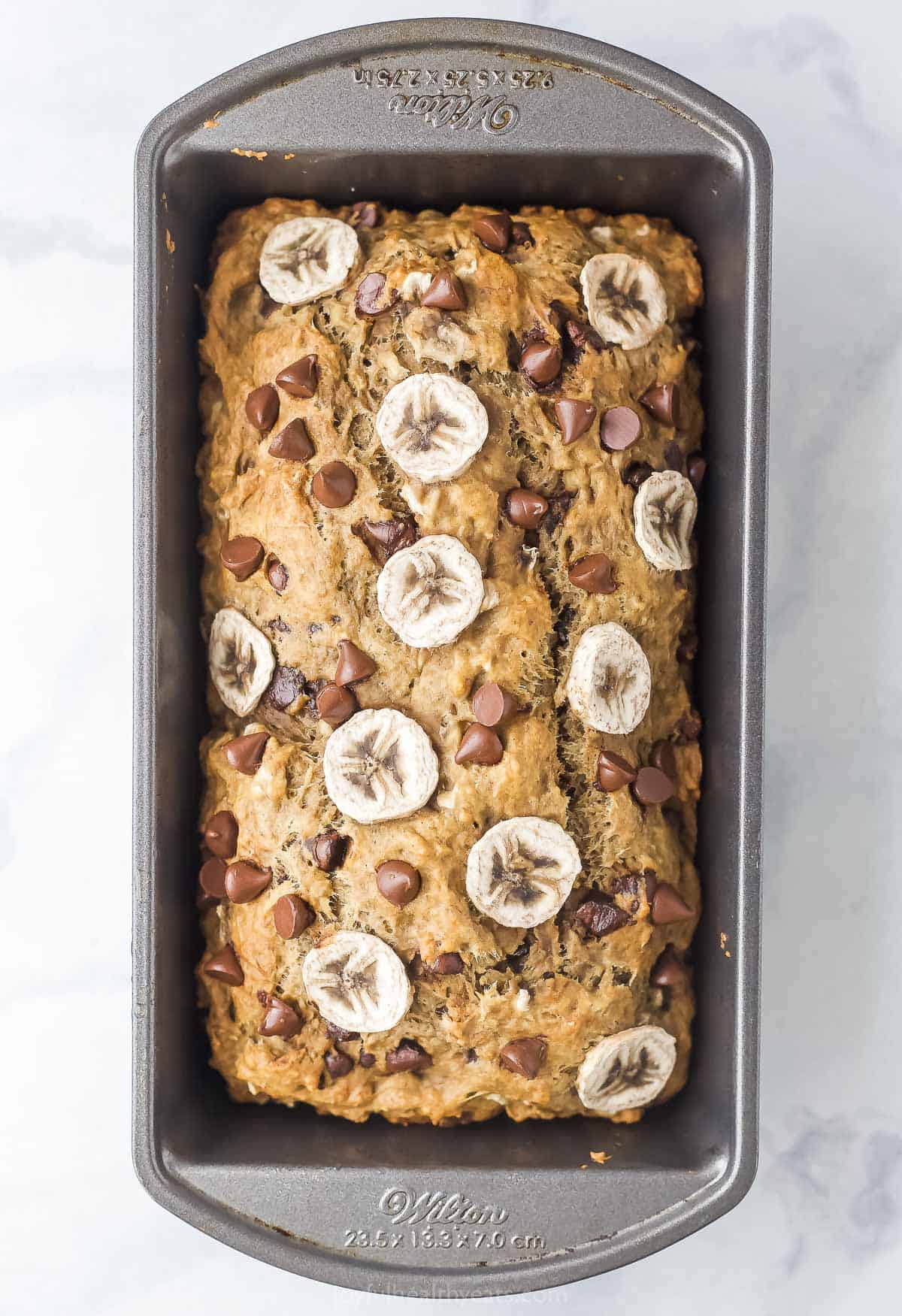 Baked loaf in its pan. 