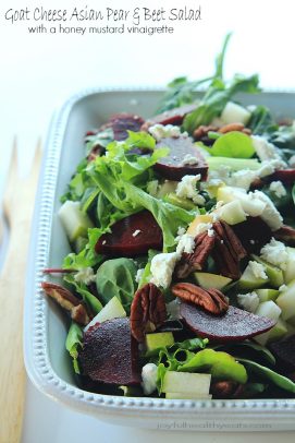 Goat Cheese Asian Pear & Roasted Beet Salad with Honey Mustard Vinaigrette in a white bowl