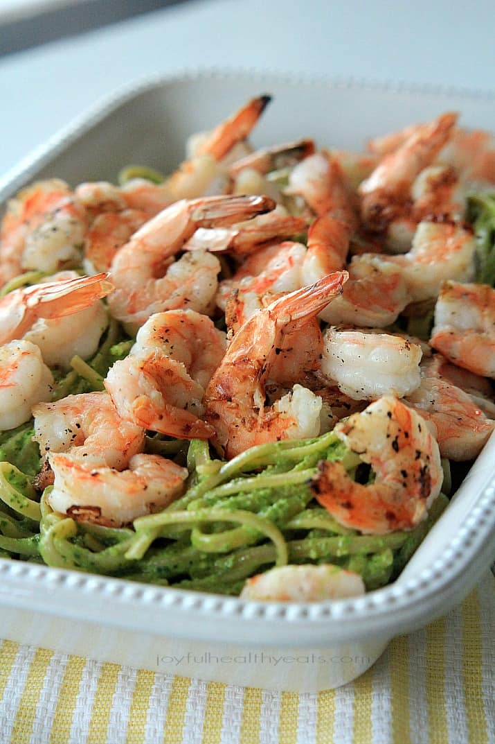 Goat Cheese Spinach Pesto Pasta with Grilled Shrimp in a serving dish