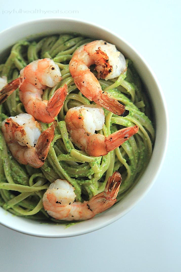 Top view of Goat Cheese Spinach Pesto Pasta with Grilled Shrimp in a bowl