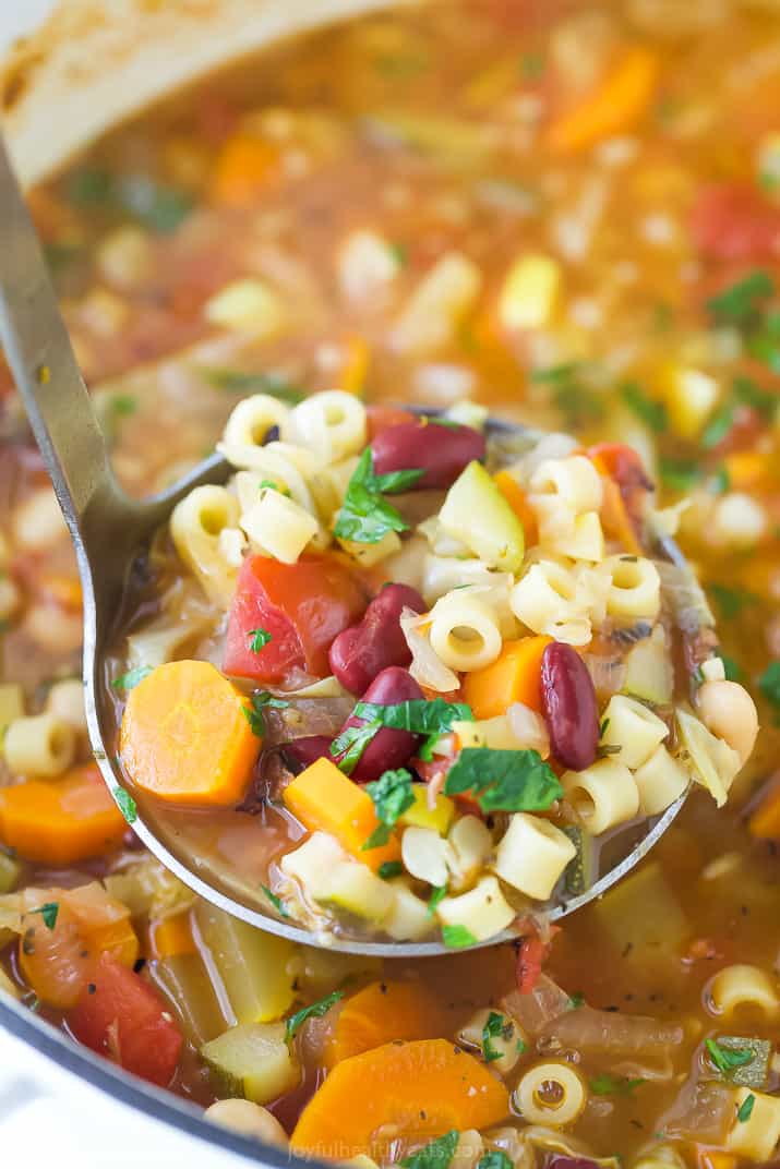 a laddle scooping easy minestrone soup