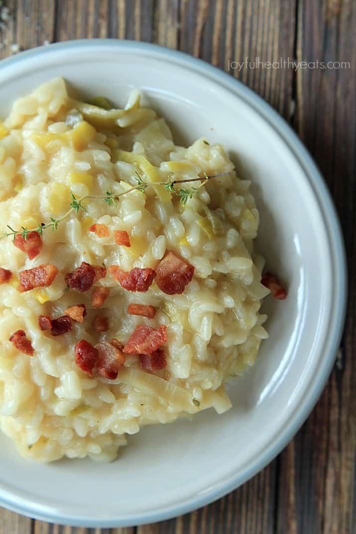 Close up view of Creamy Leek Risotto with Crispy Pancetta on a plate