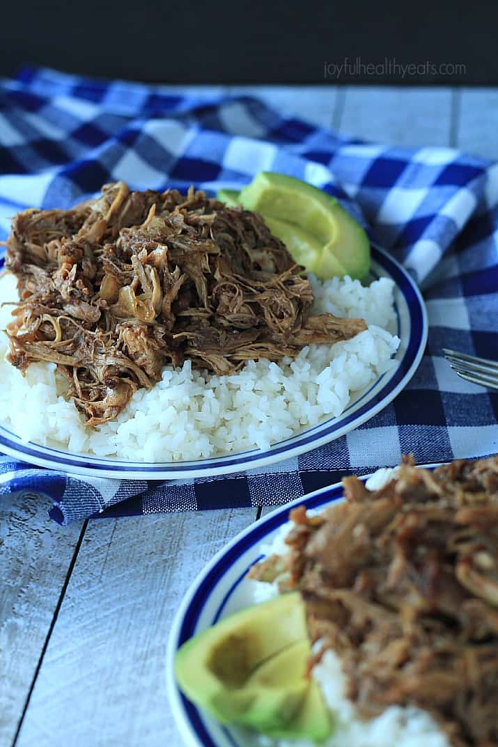 Honey Balsamic Pulled Pork on a plate over white rice with sliced avocado