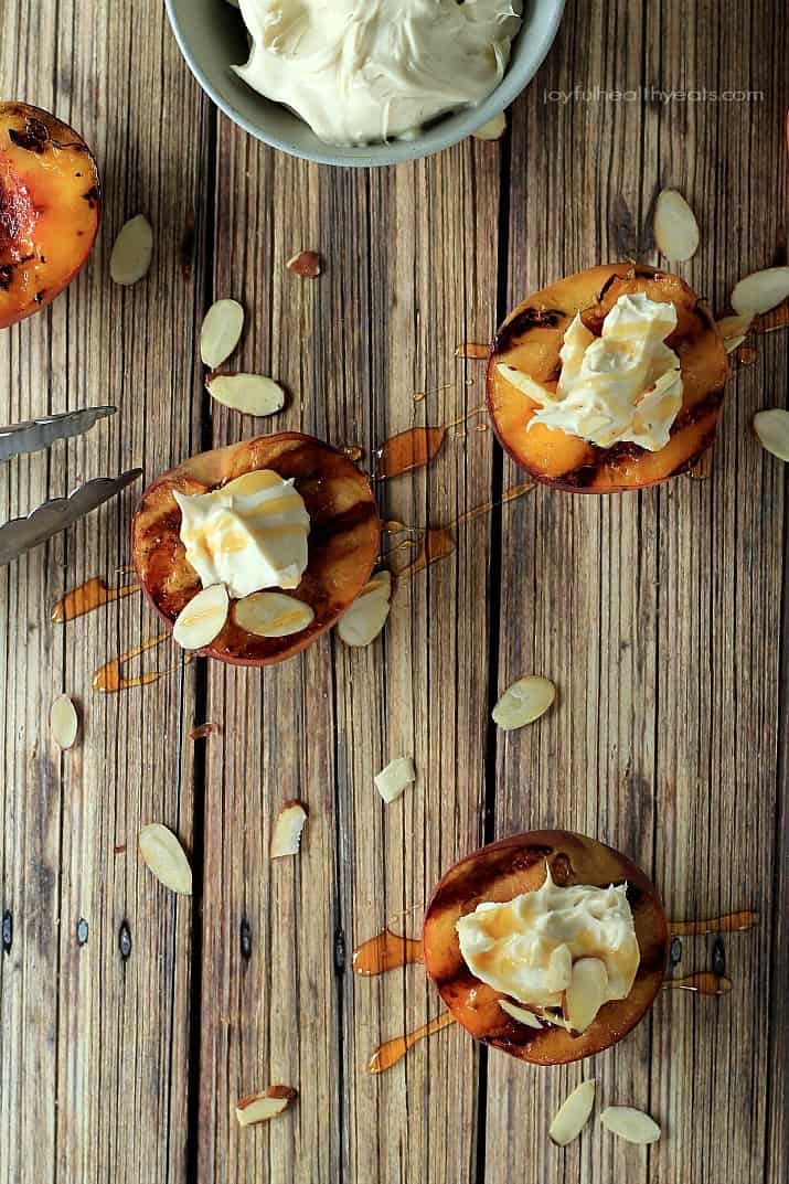 Top view of Grilled Peaches with Maple Honey Mascarpone Cheese on a wooden board