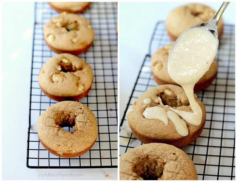 Baked Apple Donuts on a cooling rack with Cardamom Cream Cheese Glaze being added