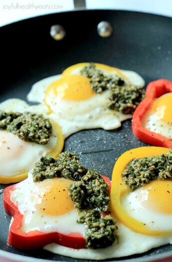 Five Egg in a Holes with Basil Pesto on a Frying Pan