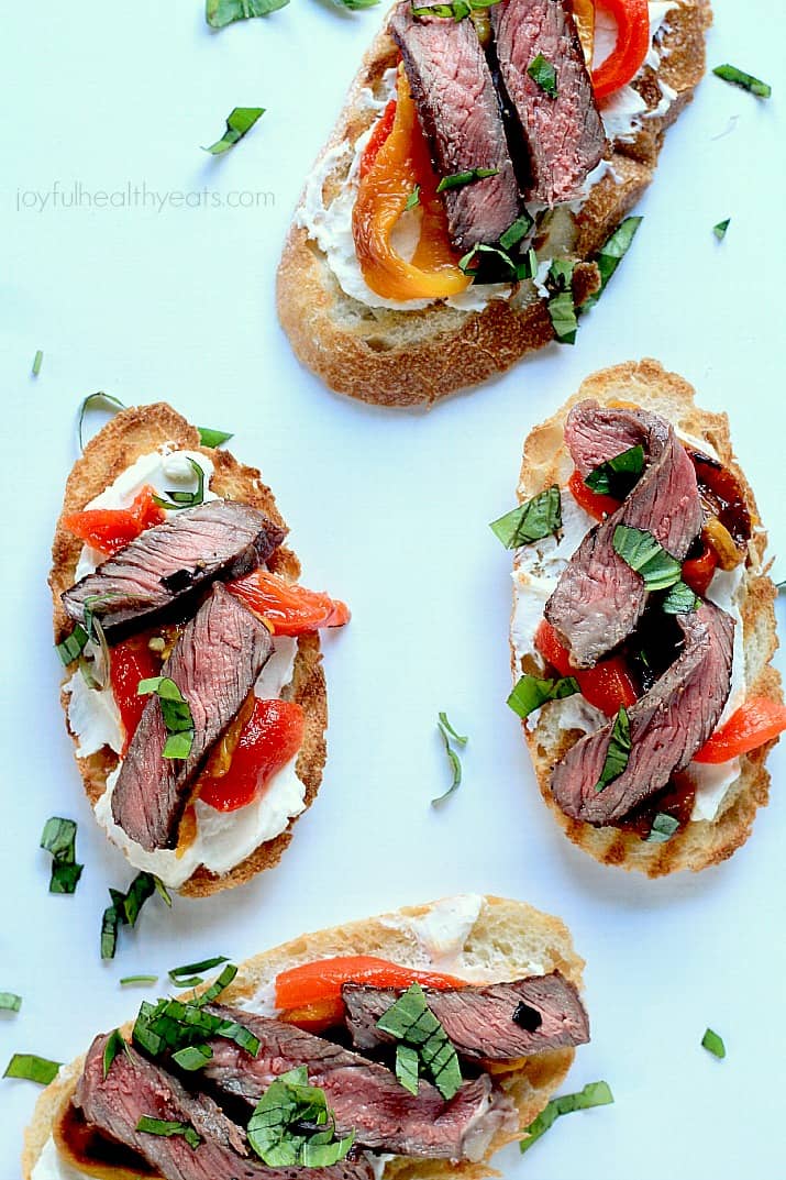 Top view of Grilled Ribeye & Roasted Pepper Bruschetta with Whipped Goat Cheese on crostini