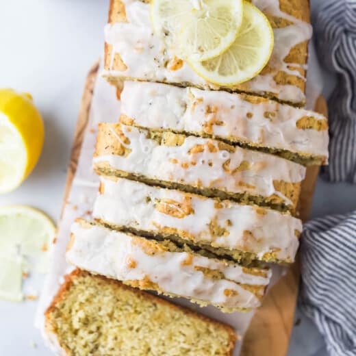 Sliced lemon poppy seed bread with glaze on top.