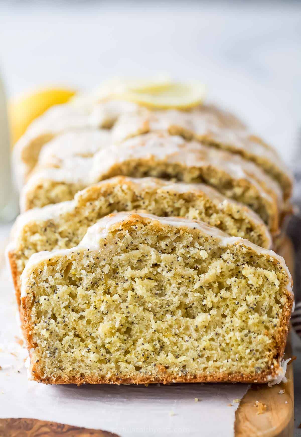 This lemon poppy seed bread is a zesty dessert-turned-breakfast packed with healthy ingredients like Greek yogurt for a guilt-free treat. Slices of poppy seed bread.