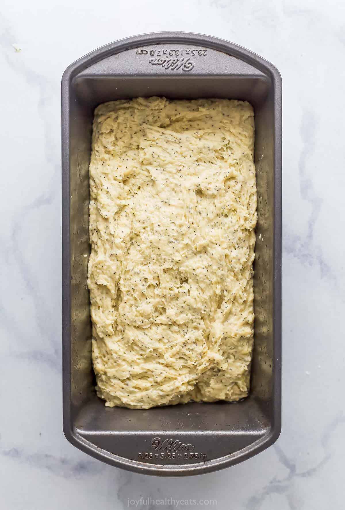 Filling the baking pan with the batter.