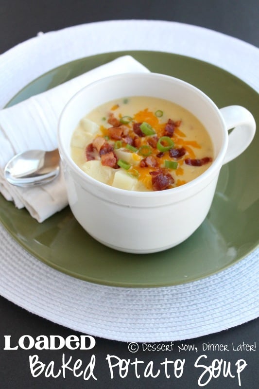 A Cup of Loaded Baked Potato Soup on a Green Plate with a Napkin