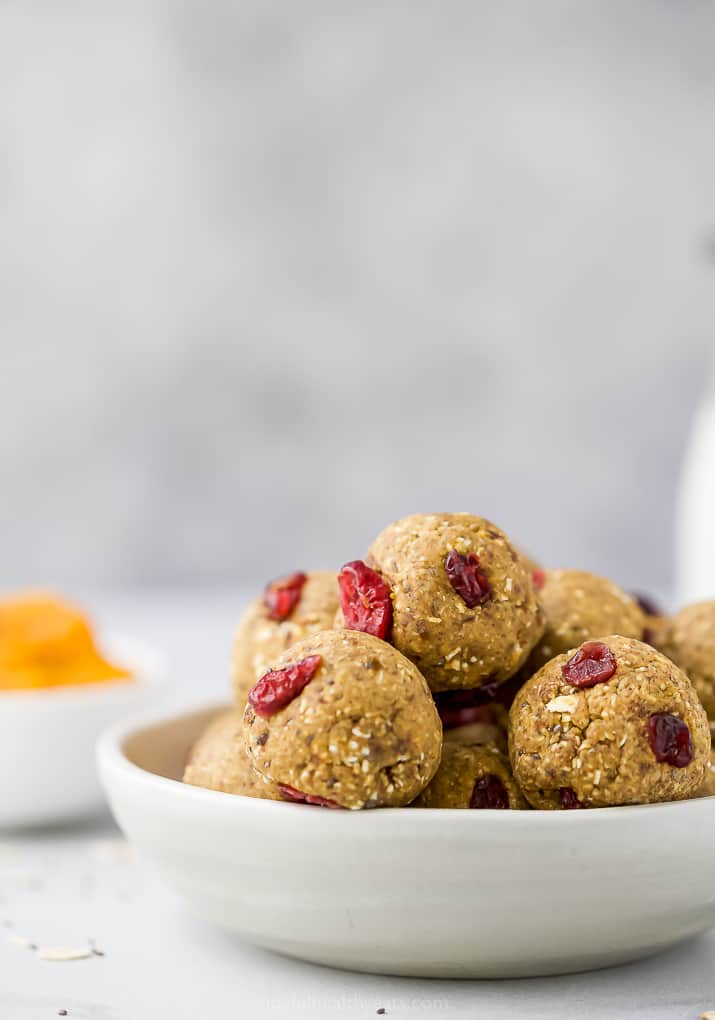 a bowl filled with no bake pumpkin energy bites