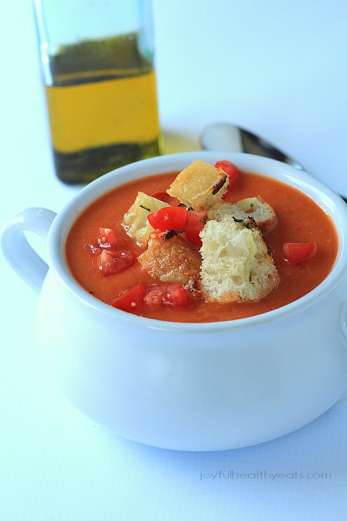 A hearty Tuscan Tomato Soup with Homemade Rosemary Garlic Croutons! | www.joyfulhealthyeats.com | #wintersoup #souprecipes #vegetarian #freezerfriendly