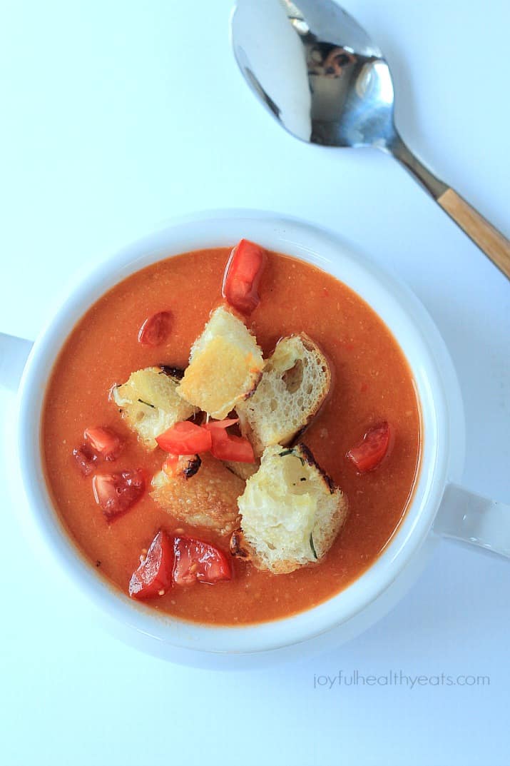 A hearty Tuscan Tomato Soup with Homemade Rosemary Garlic Croutons! | www.joyfulhealthyeats.com | #wintersoup #souprecipes #vegetarian #freezerfriendly