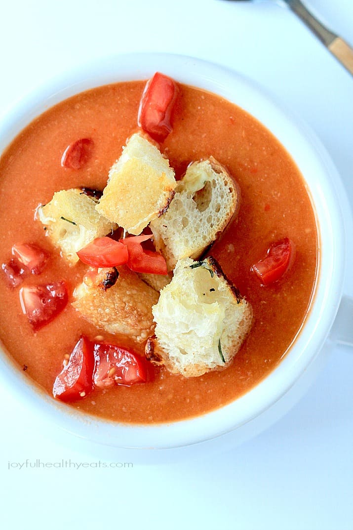 A hearty Tuscan Tomato Soup with Homemade Rosemary Garlic Croutons! | www.joyfulhealthyeats.com | #wintersoup #souprecipes #vegetarian #freezerfriendly
