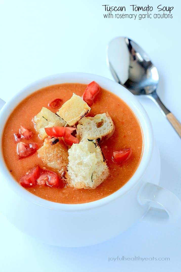 A hearty Tuscan Tomato Soup with Homemade Rosemary Garlic Croutons! | www.joyfulhealthyeats.com | #wintersoup #souprecipes #vegetarian #freezerfriendly