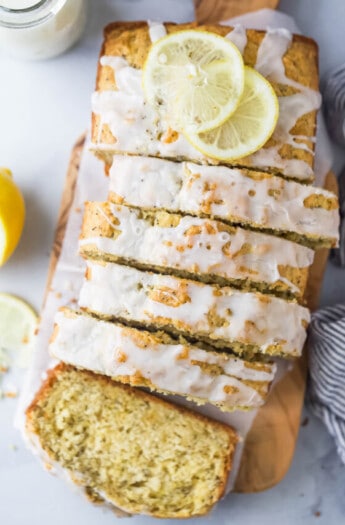 Sliced lemon poppy seed bread with glaze on top.